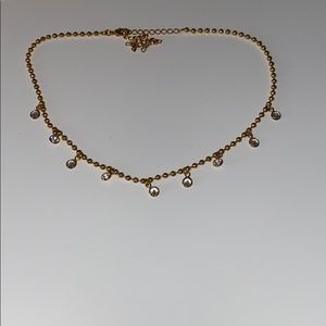 Gold choker with diamonds hanging